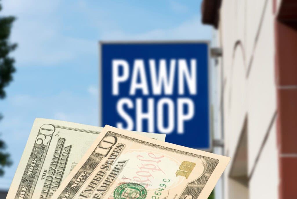 cash money in front of a pawn shop sign.

sell gold to pawn shop