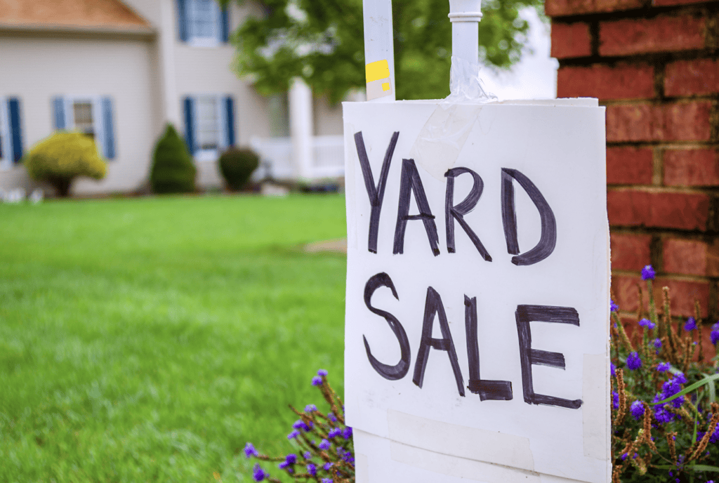 yard sale tips to make money. picture of yard sale sign in front yard.